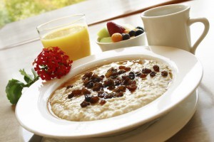 Breakfast of freshly prepared oatmeal topped with raisins. Served with your choice of coffee or orange juice and a cup of fruit.
